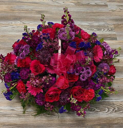 Shades of Purple & Hot Pink in White Basket from Anthony's Florist in Laurel, MS